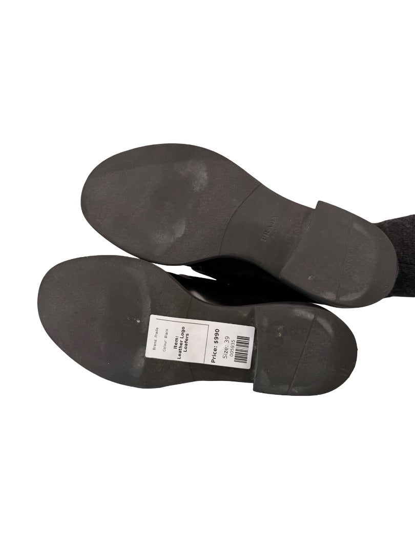Prada Black Brushed Leather Triangle Logo Loafers. Size: 39