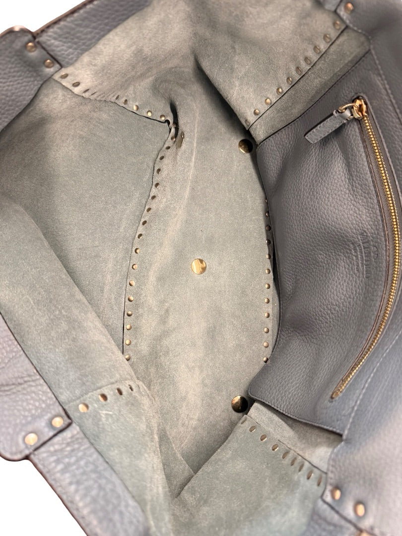 Valentino Garavani Blue Large Studded Rockstud Leather 'Trapeze' Crossbody Bag.