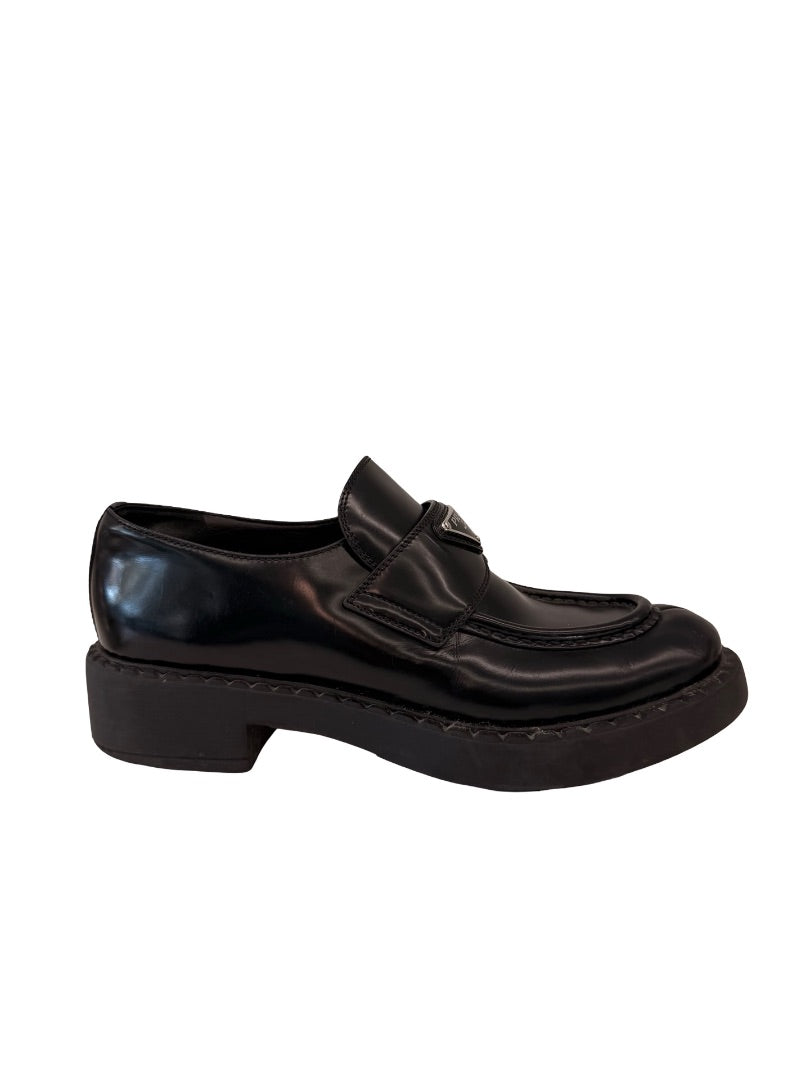 Prada Black Brushed Leather Triangle Logo Loafers. Size: 39