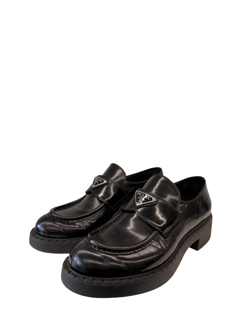 Prada Black Brushed Leather Triangle Logo Loafers. Size: 39