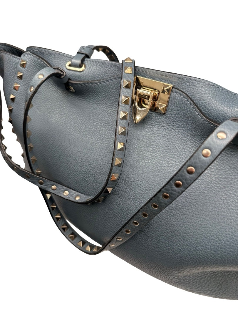 Valentino Garavani Blue Large Studded Rockstud Leather 'Trapeze' Crossbody Bag.