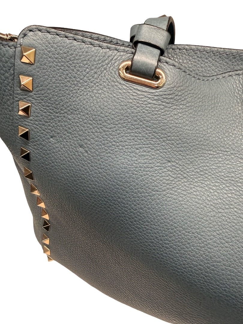 Valentino Garavani Blue Large Studded Rockstud Leather 'Trapeze' Crossbody Bag.