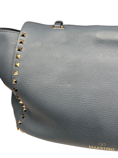 Valentino Garavani Blue Large Studded Rockstud Leather 'Trapeze' Crossbody Bag.