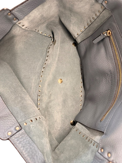 Valentino Garavani Blue Large Studded Rockstud Leather 'Trapeze' Crossbody Bag.