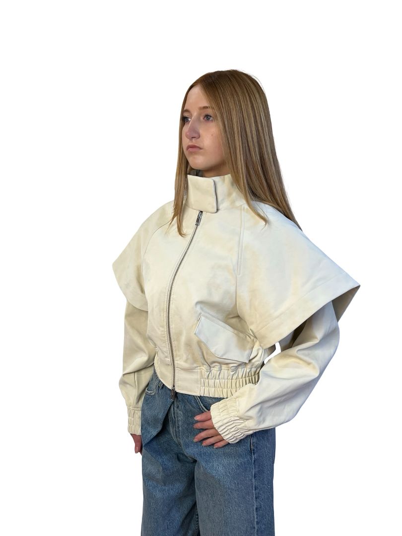 AKNVAS Cream Fake Leather Jacket w/ Cape Sleeve Overlay. Size: XS