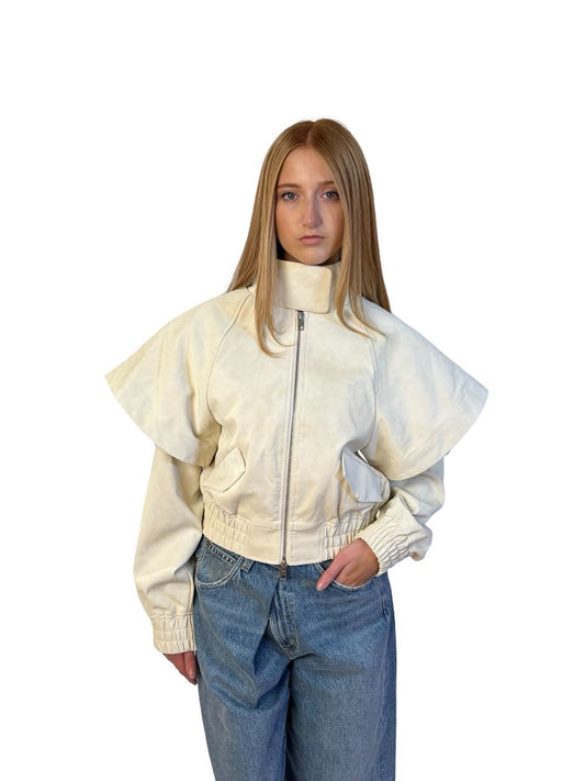 AKNVAS Cream Fake Leather Jacket w/ Cape Sleeve Overlay. Size: XS